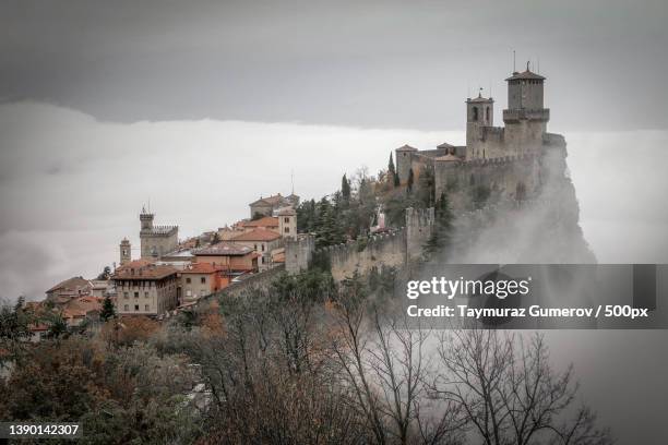 san marino,view of buildings against cloudy sky - san marino - fotografias e filmes do acervo