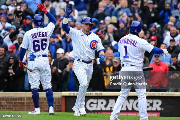 Nico Hoerner of the Chicago Cubs celebrates with Rafael Ortega of the Chicago Cubs after his two run home run in the fifth inning against the...