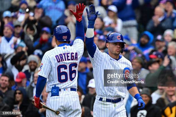 Nico Hoerner of the Chicago Cubs celebrates with Rafael Ortega of the Chicago Cubs after his two run home run in the fifth inning against the...