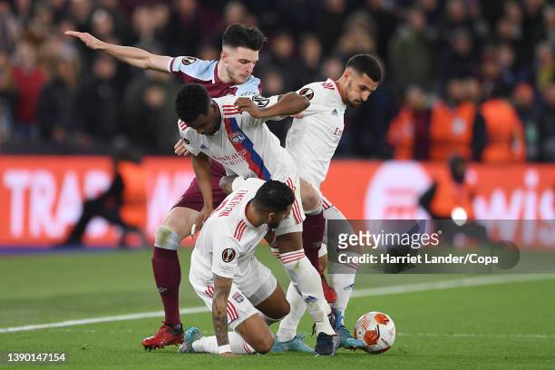 Declan Rice of West Ham United is challenged by Emerson, Thiago Mendes, Houssem Aouar of Olympique Lyon and during the UEFA Europa League Quarter...