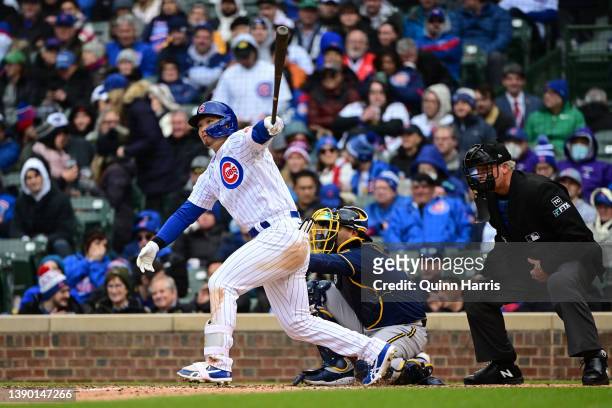 Seiya Suzuki of the Chicago Cubs hits a single in the fifth inning against the Milwaukee Brewers on Opening Day at Wrigley Field on April 07, 2022 in...