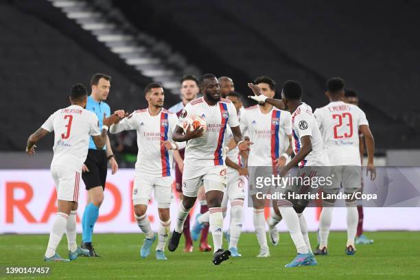 Tanguy Ndombele of Olympique Lyon celebrates with teammates after scoring his team's first goal during the UEFA Europa League Quarter Final Leg One...