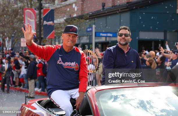 Manager Brian Snitker of the Atlanta Braves sits alongside President of Baseball Operations & General Manager Alex Anthopoulos during the Atlanta...