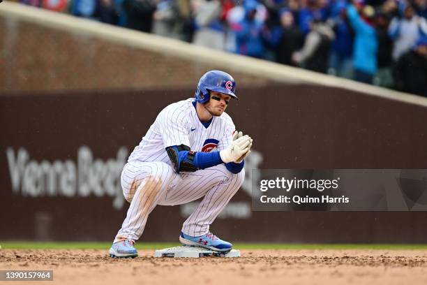 Ian Happ of the Chicago Cubs reacts on second base after hitting a two-run double in the seventh inning against the Milwaukee Brewers on Opening Day...
