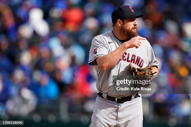 Bryan Shaw of the Cleveland Guardians prepares to pitch against the Kansas City Royals in the fifth inning during Opening Day at Kauffman Stadium on...