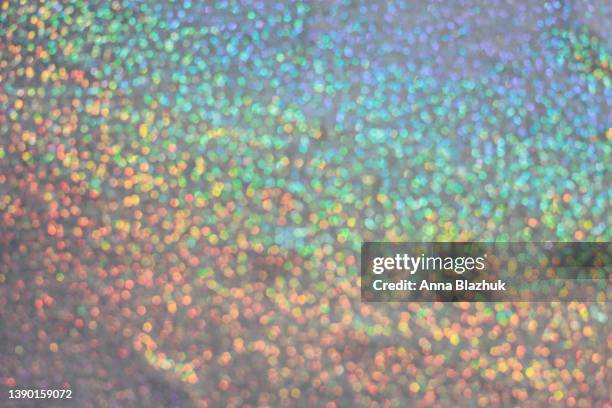 abstract iridescent rainbow glitter background. bold colorful background. - iridescent stockfoto's en -beelden