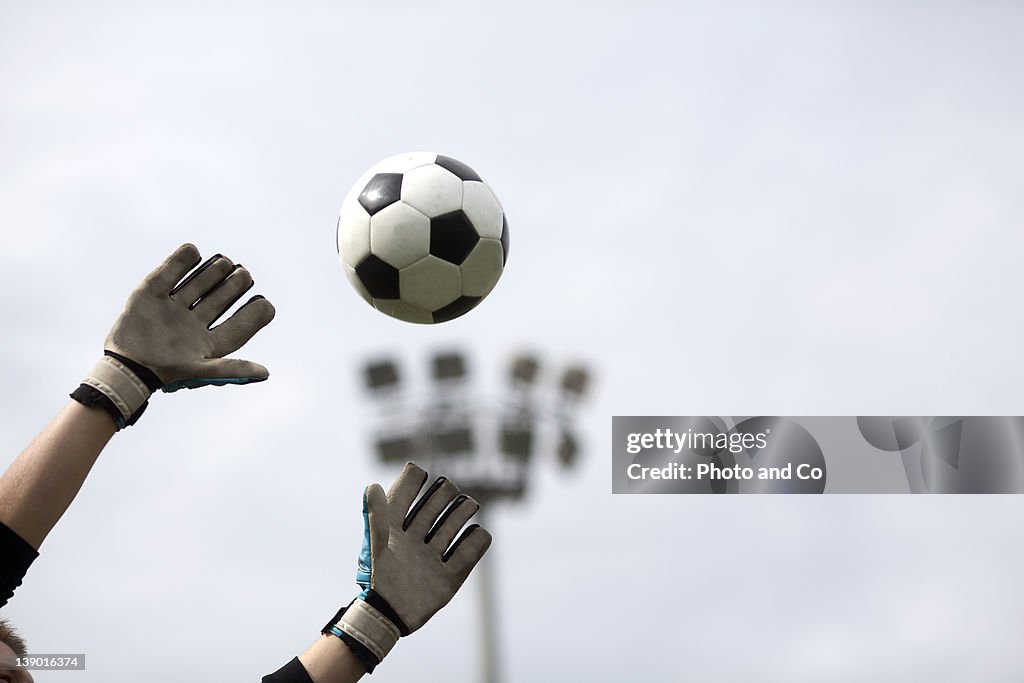 Goalkeeper reaching for ball