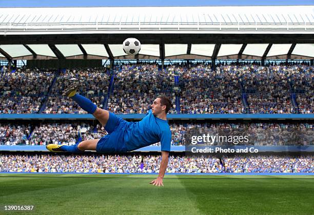 male soccer ball player kicking ball - soccer match stock pictures, royalty-free photos & images