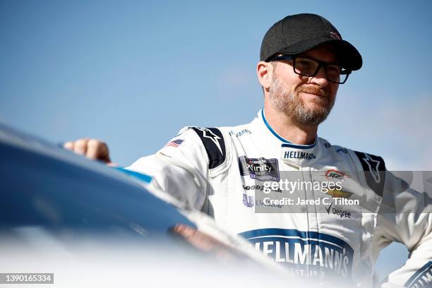 Dale Earnhardt Jr, driver of the Hellmann's Fridge Hunters Chevrolet, looks on during practice for the NASCAR Xfinity Series Call 811 Before You Dig...