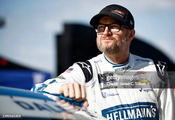 Dale Earnhardt Jr, driver of the Hellmann's Fridge Hunters Chevrolet, looks on during practice for the NASCAR Xfinity Series Call 811 Before You Dig...