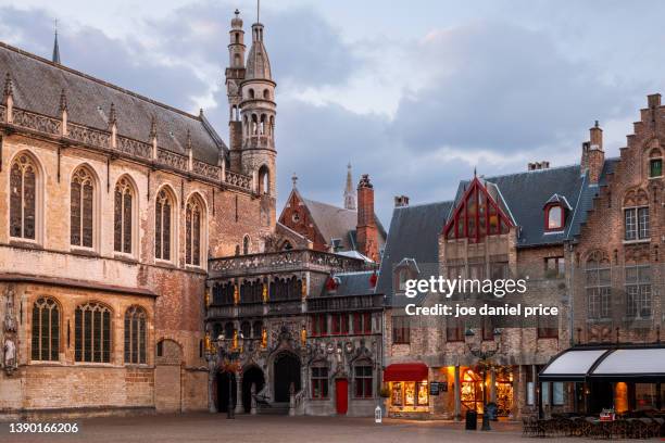 sunset, basilica of the holy blood, burg square, bruges, flanders, belgium - basiliek stockfoto's en -beelden