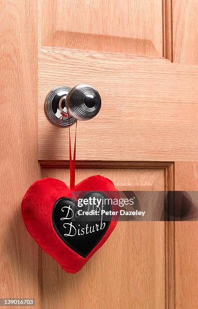 heart-shaped 'do not disturb' sign - do not disturb sign stock pictures, royalty-free photos & images