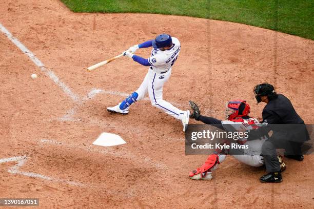 Andrew Benintendi of the Kansas City Royals connects on a Cleveland Guardians pitch and scores the third run of the game in the eight inning during...