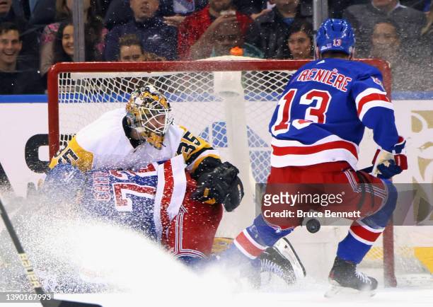 Tristan Jarry of the Pittsburgh Penguins makes the first period save on Filip Chytil of the New York Rangers at Madison Square Garden on April 07,...