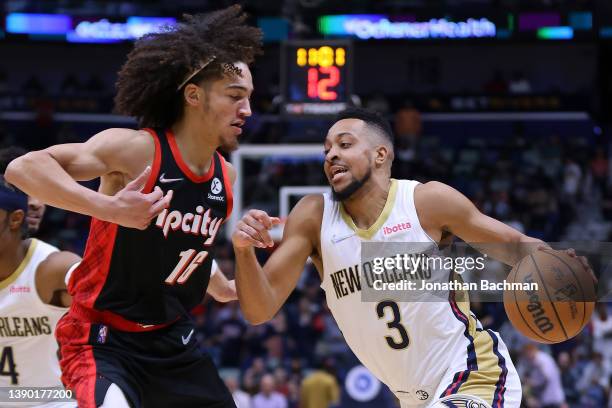 McCollum of the New Orleans Pelicans drives against CJ Elleby of the Portland Trail Blazers during the first half at the Smoothie King Center on...