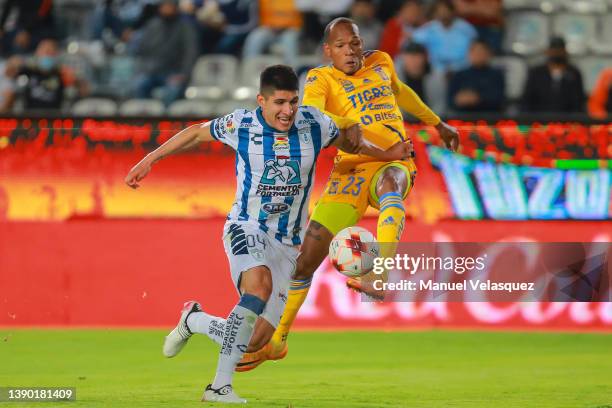 Luis Quiñones of Tigres battles for the ball against Miguel Tapias of Pachuca during the 9th round match between Pachuca and Tigres UANL as part of...