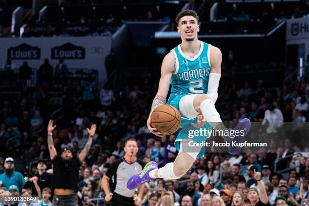 LaMelo Ball of the Charlotte Hornets lobs up the ball for an alley-oop in the fourth quarter during their game against the Orlando Magic at Spectrum...