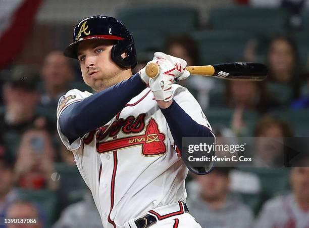 Austin Riley of the Atlanta Braves watches his line drive in the third inning against the Cincinnati Reds at Truist Park on April 07, 2022 in...