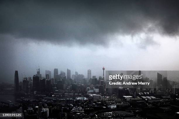 urban city skyline, dark gray rain storm clouds, sydney, australia - sydney skyline stock pictures, royalty-free photos & images