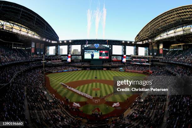 General view as the Arizona Diamondbacks and the San Diego Padres stand attended for the national anthem before the MLB opening day game at Chase...