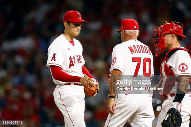 Manager Joe Maddon takes out Shohei Ohtani of the Los Angeles Angels in the fifth inning against the Houston Astros on Opening Day at Angel Stadium...