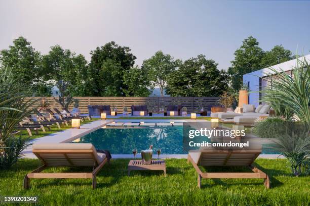 moderne luxusvilla mit großer terrasse, pool, sofa und liegestühlen - man in swimming pool stock-fotos und bilder