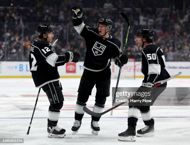 Trevor Moore of the Los Angeles Kings celebrates his short handed goal with Olli Maatta and Sean Durzi of the Los Angeles Kings, to tie the game 1-1...