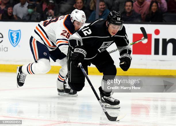 Trevor Moore of the Los Angeles Kings skates away from Leon Draisaitl of the Edmonton Oilers to score a short handed goal, to tie the game 1-1,...