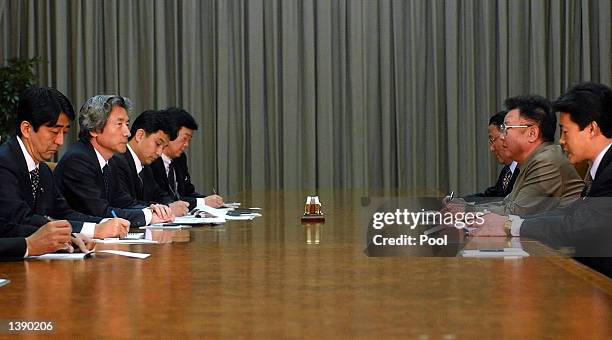 North Korean leader Kim Jong-il and Japanese Prime Minister Junichiro Koizumi begin their talks at the Paekhwawon state guesthouse on September 17,...