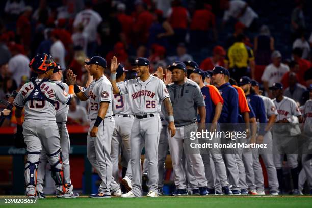 The Houston Astros celebrate a 3-1 win against the Los Angeles Angels in the ninth inning on Opening Day at Angel Stadium of Anaheim on April 07,...