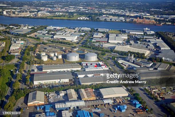 industrial district near airport and brisbane river, aerial view - brisbane airport stock pictures, royalty-free photos & images