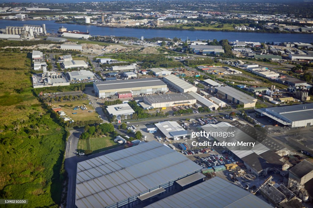 Industrial district near airport and Brisbane River, aerial view