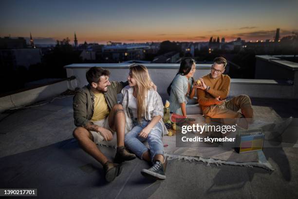 picnic on a roof at dusk! - night picnic stock pictures, royalty-free photos & images