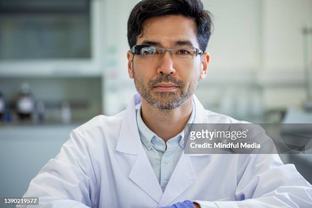portrait of asian american mid adult lab technician wearing smart glasses - smart glasses stock pictures, royalty-free photos & images