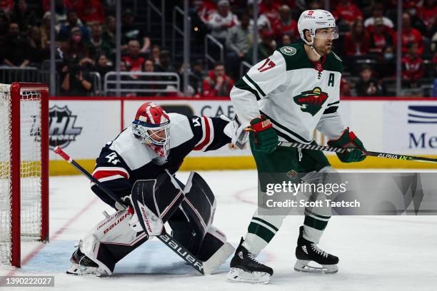 Vitek Vanecek of the Washington Capitals tends net as Marcus Foligno of the Minnesota Wild screens during the third period of the game at Capital One...