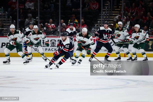 Evgeny Kuznetsov of the Washington Capitals skates with the puck against the Minnesota Wild during the third period of the game at Capital One Arena...