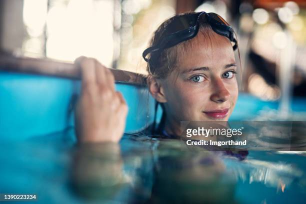 portrait of a teenage girl at the swimming pool - girl wet stock pictures, royalty-free photos & images