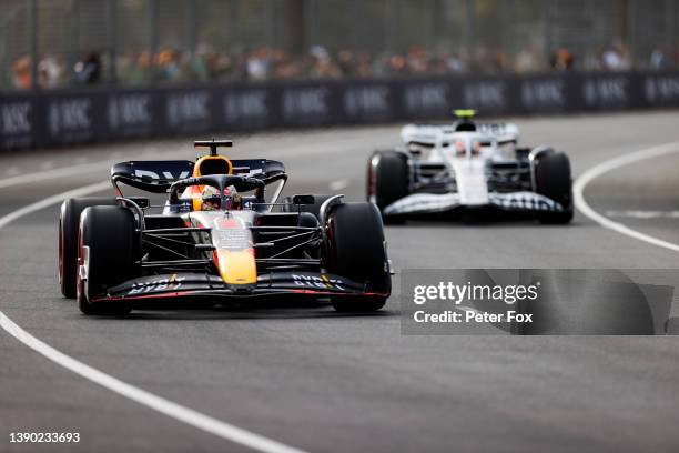 Max Verstappen of Red Bull Racing and The Netherlands and Yuki Tsunoda of Scuderia AlphaTauri and Japan during practice ahead of the F1 Grand Prix of...