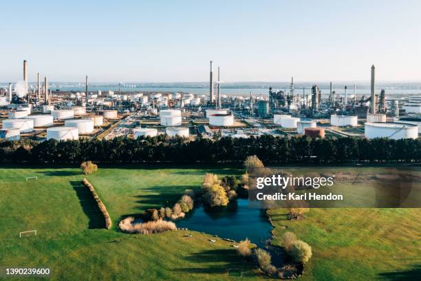 an aerial view of a park and pond in front of a power station - southampton inglaterra imagens e fotografias de stock