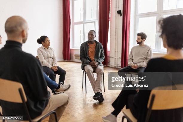 african american man talking while being on group therapy at community center - promises rehab center bildbanksfoton och bilder