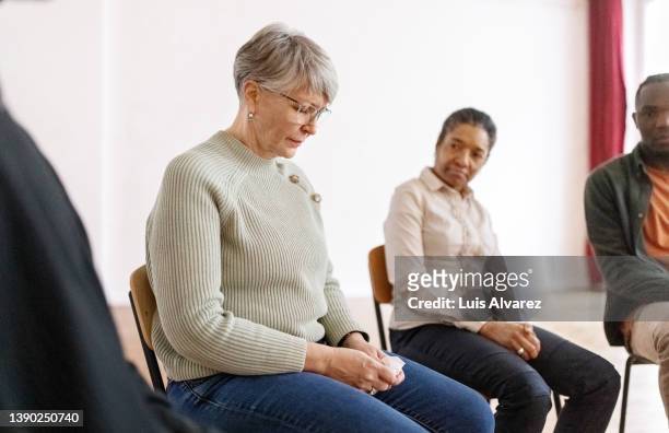 woman sharing her problems in meeting of support group in community center - promises rehab center bildbanksfoton och bilder