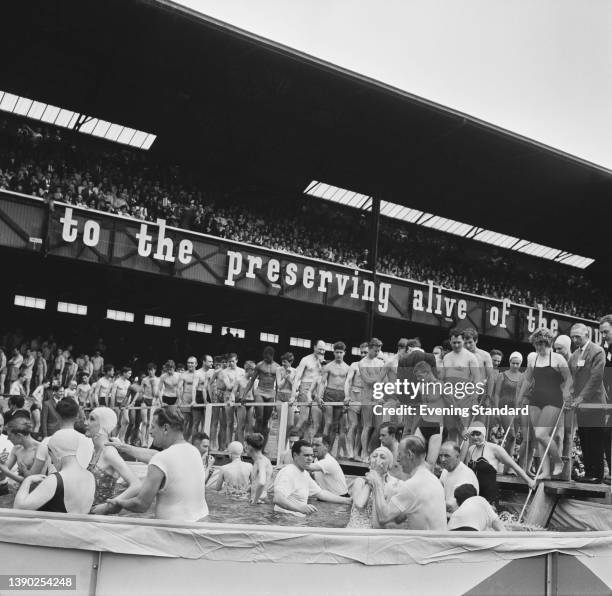 Jehovah's Witnesses in the baptism pool at Twickenham Stadium in London, UK, 19th July 1963.