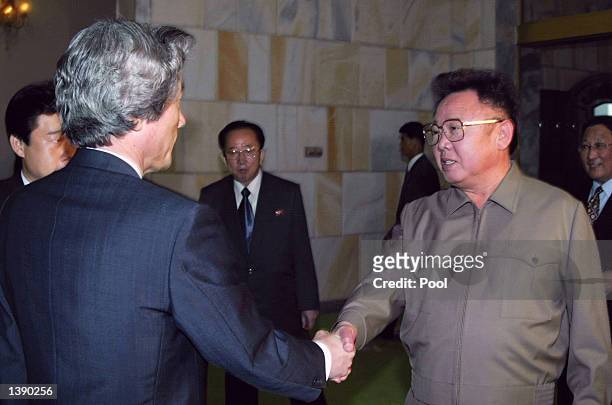 Japanese Prime Minister Junichiro Koizumi shakes hands with North Korean leader Kim Jong-il prior to their summit talks at the Paekhwawon state...