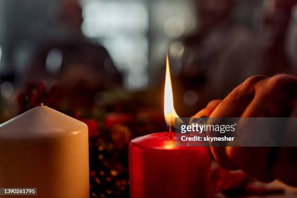 lighting a candle! - cigarette lighter stock pictures, royalty-free photos & images