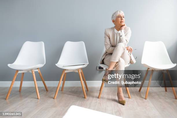 she's losing patience - chair business stockfoto's en -beelden