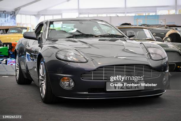 The 2002 Aston Martin Vanquish, first owned by actor Hugh Grant, at Goodwood Motor Circuit on April 08, 2022 in Chichester, England. The 1956...