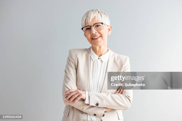 portrait of a happy businesswoman - grey suit stock pictures, royalty-free photos & images