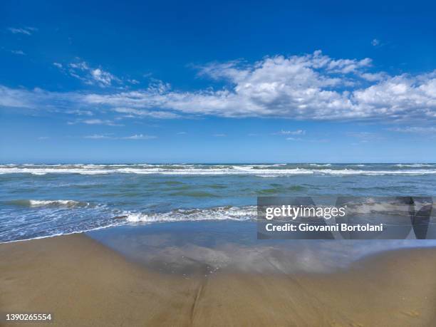 sea in spring, sky and clouds of the romagna riviera - riccione stock pictures, royalty-free photos & images