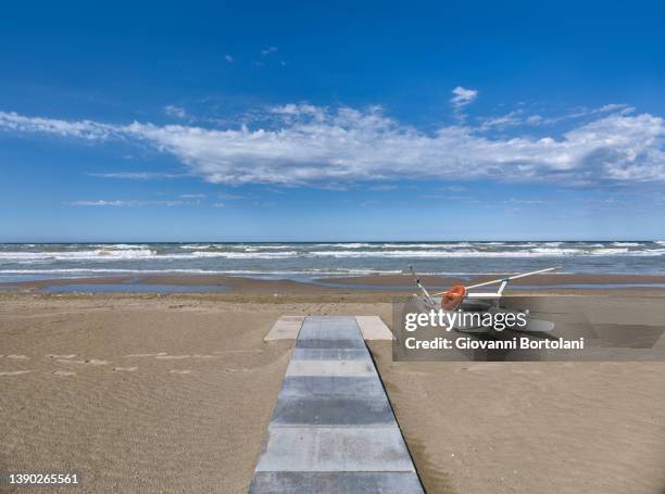 rowing rescue boat, sea, sky and clouds of the romagna riviera - riccione stock pictures, royalty-free photos & images