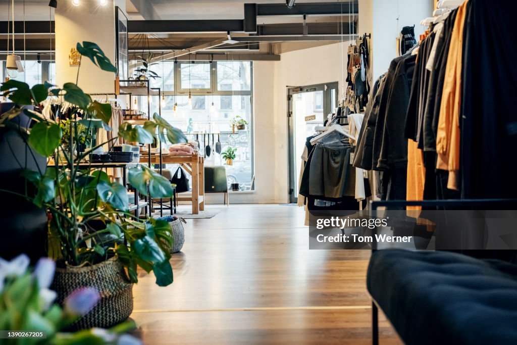 Fashionable Clothing Store With Garments On Display High-Res Stock ...